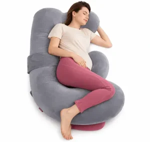 Pregnant woman resting on a gray maternity pillow for side sleeping, belly support, and better pregnancy comfort.
